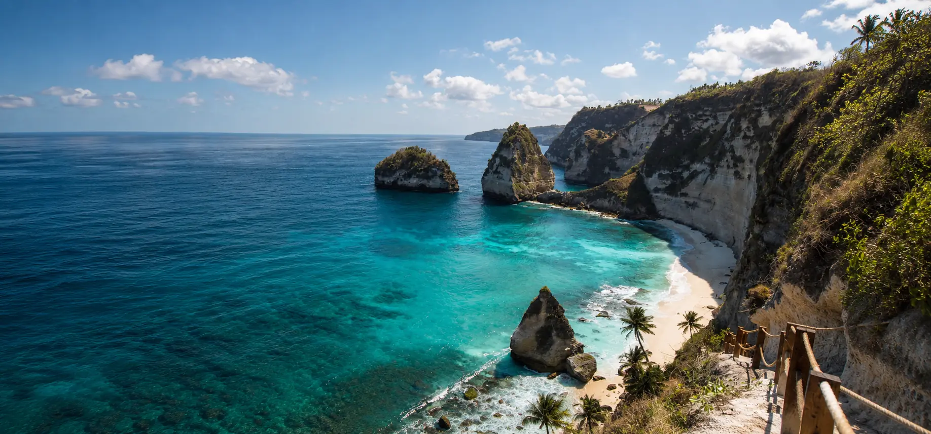 Panoramic Diamond Beach coastline with turquoise water and limestone cliffs in East Nusa Penida